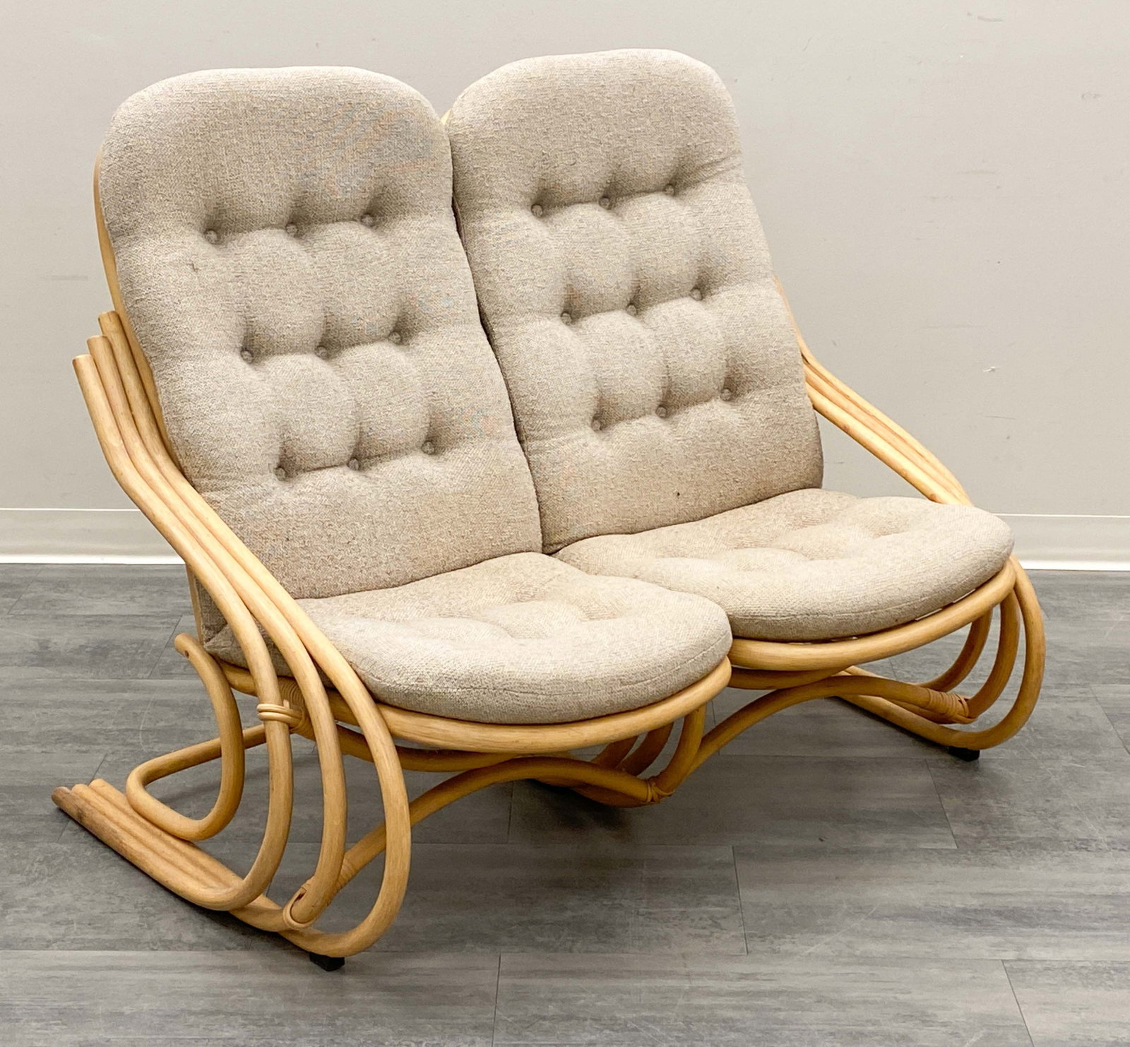 DANISH BAMBOO LOVESEAT SOFA C. 1970S: Bamboo frame and tufted upholstery. Denmark, circa 1970. Dimensions: H 40" x W 49.25" x D 31" x SH 17" Condition: Wear consistent with age and use. Some discoloration to base,