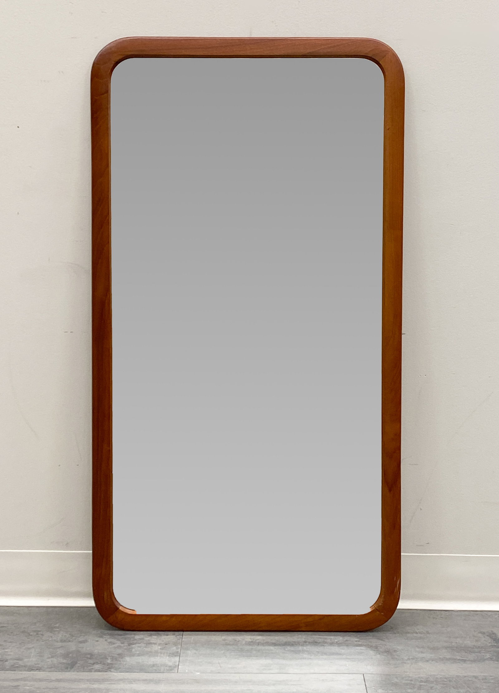 E. S. SCANDINAVIAN TEAK WALL MIRROR C. 1960S: Dimensions: H 41.5" x W 21.75" Condition: Wear consistent with age and use. Backing is loose, needs reinforcements.