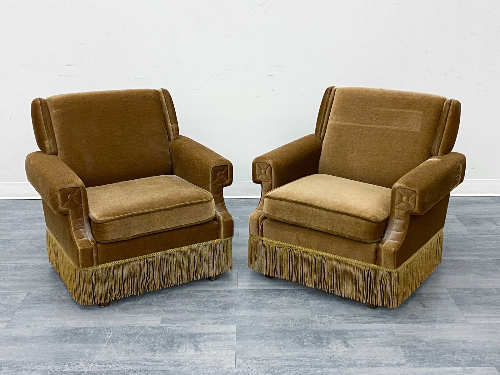PAIR VINTAGE SCANDINAVIAN MOHAIR LOUNGE CHAIRS: Mohair upholstery and fringe details. Circa 1950s. Dimensions: H 31" x W 29" x D 31" x SH 15.5" Condition: Wear consistent with age and use. Some indentations to backrests.
