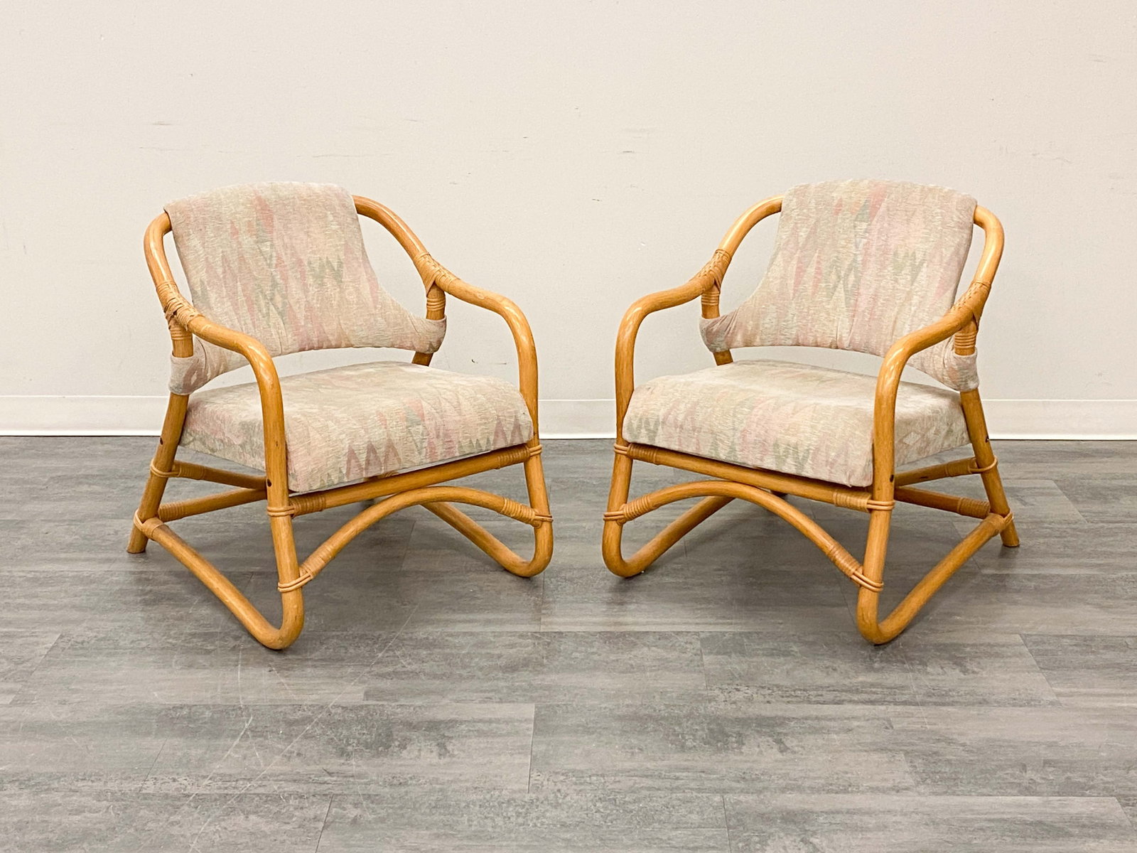 PAIR DANISH BAMBOO LOUNGE CHAIRS 1970S: Bamboo frame & diamond-pattern upholstery. Denmark, circa 1970s. Dimensions: H 30.5" x W 24" x D 31" x SH 17" Condition: Wear consistent with age and use. Some fading to upholstery. Scuffs, nicks