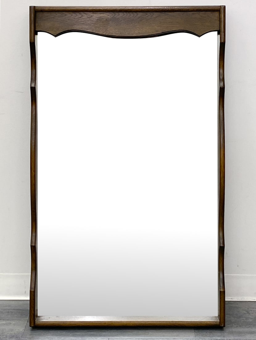 STILO MOBLER DANISH OAK WALL MIRROR C. 1960S: Stained oak frame. With light fixture. Marked to back. Denmark, circa 1960s. Dimensions: H 45.75'' x W 27.75'' Condition: Wear consistent with age and use. Light fixture untested. Scuffs, some fading