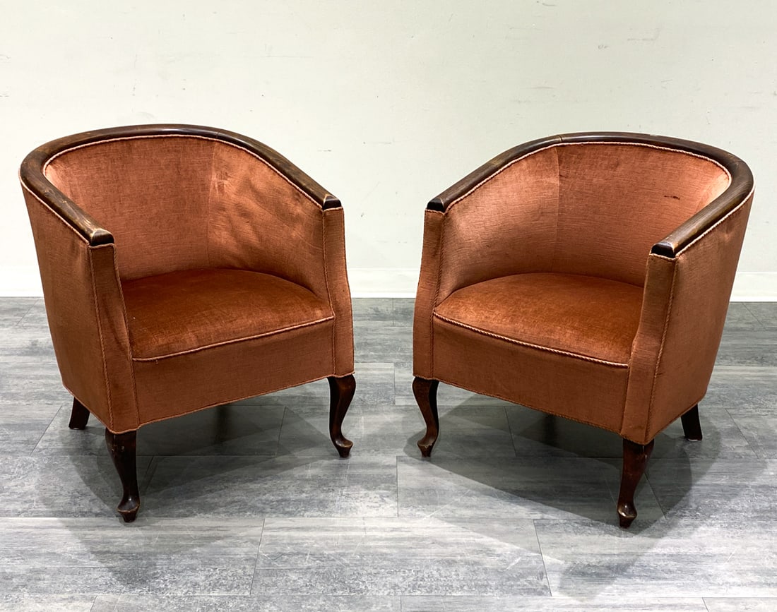 PAIR ART DECO STYLE SWEDISH CLUB CHAIRS: Beech frame in a barrel shape. Pink upholstery. Denmark, circa 1940s. Dimensions: H 30.5'' x W 24.5'' x D 27 '' x SH 16'' Condition: Wear consistent with age and use. Minor scuffs, fading to wood