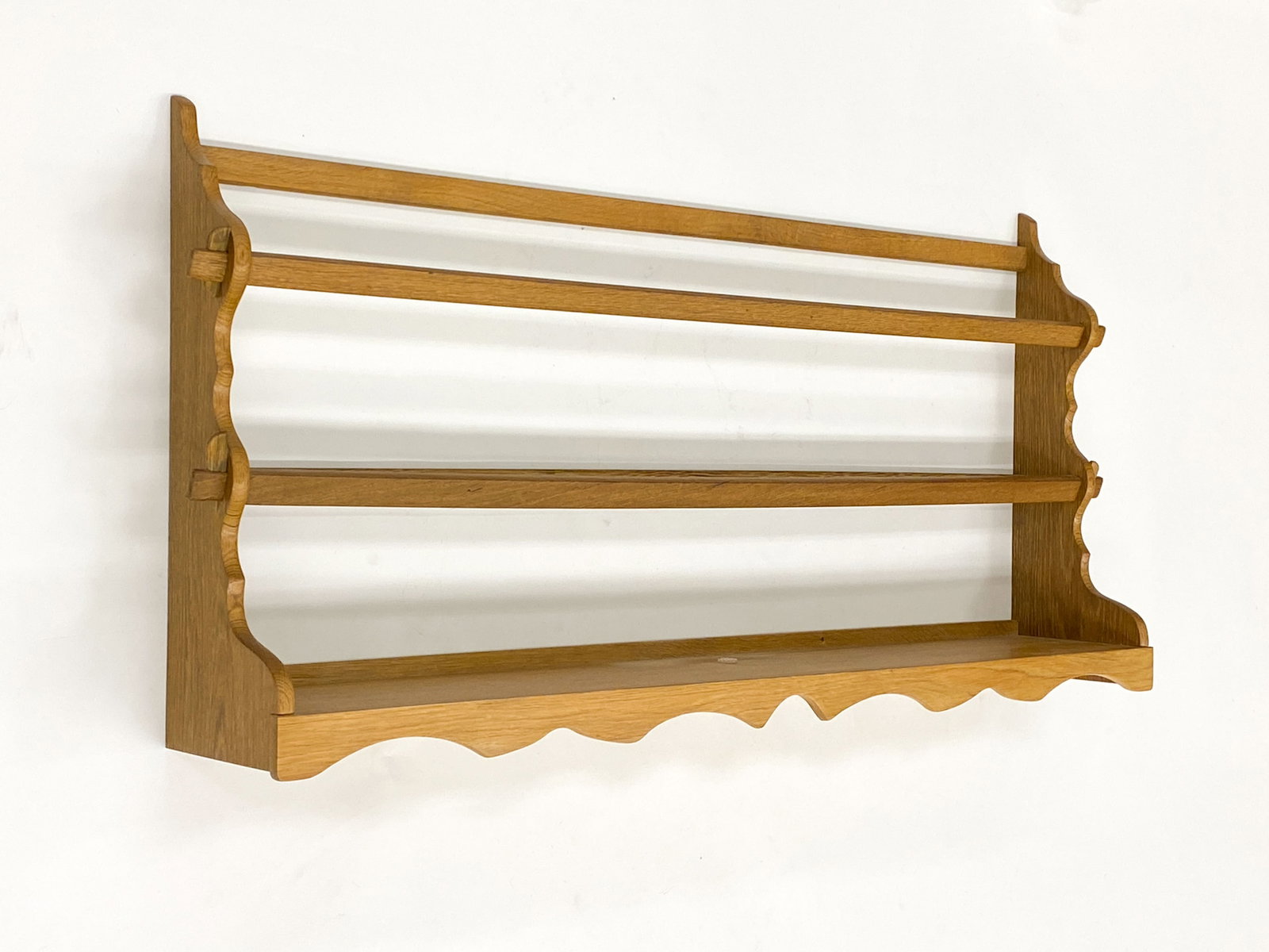 SCANDINAVIAN OAK WALL RACK C. 1960S: Denmark, circa 1960s. Dimensions: H 20" x W 41" x D 7" Condition: Wear consistent with age and use. One side is missing one dowel.