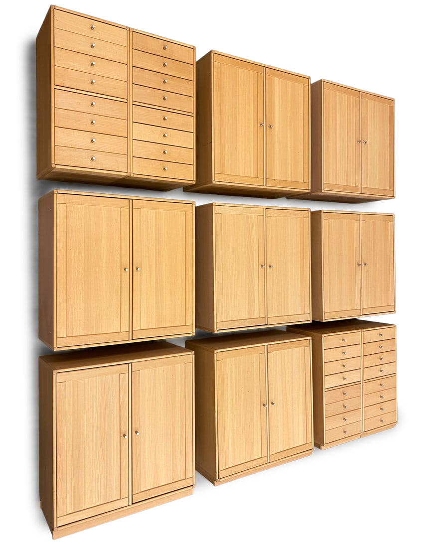 CASO "RIMME" DANISH BEECH MODULAR CABINETS: 11-piece wall unit. 7 cabinets and 4 chests. Apparently unmarked. Dimensions: (Total) H 100" x W 96" x D 13.75" (Largest) H 29.5" x W 28.5" x D 13.75" Condition: Rubs, scuffs to corners. Scratches, so