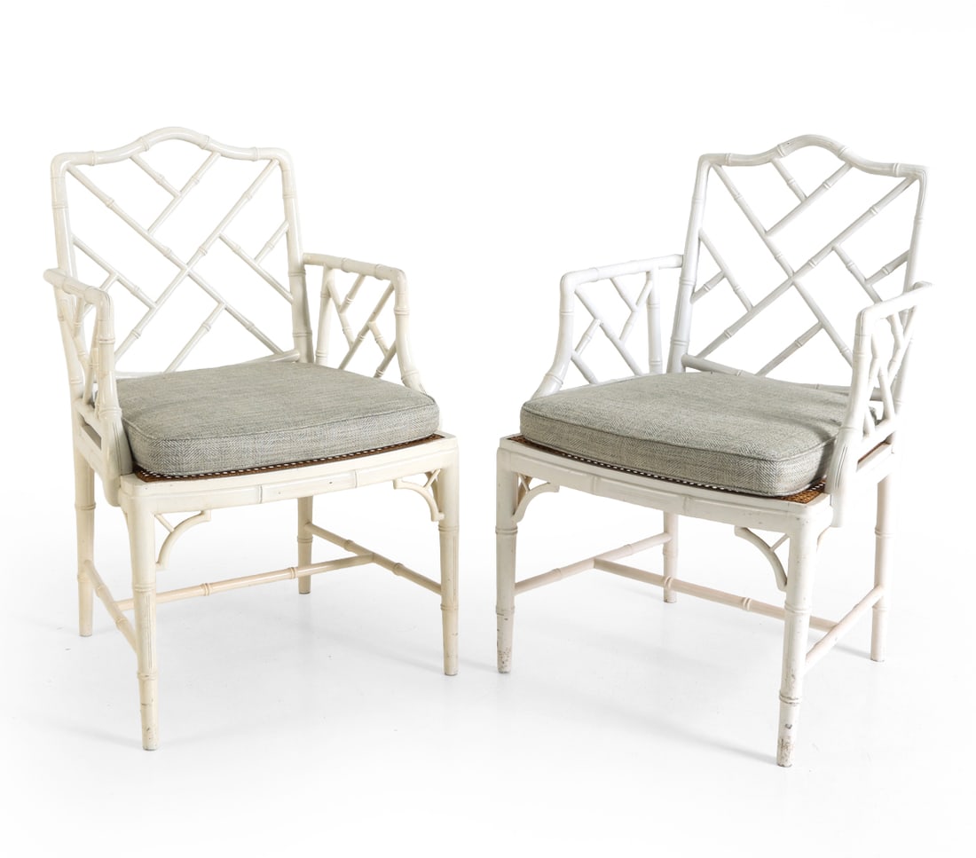 PAIR CHINESE CHIPPENDALE STYLE FAUX BAMBOO CHAIRS: Faux bamboo armchair with latticed back and arms. Caned seat. Dimensions: H 36.25" x W 23.25" x D 21" x SH 19" Condition: Scratches, rubs and losses to paint. Wear consistent with age and use.