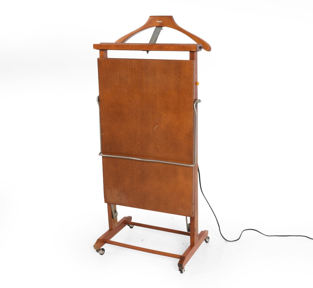 ICO & LUISA PARISI FRATELLI REGUITTI ITALIAN VALET: Gentleman's valet with trouser press on casters in beech. Marked to frame. Italy, circa 1970s. Dimensions: H 39.5" x W 17.5" x D 13". Condition: Wiring untested. Wear consistent with age and use.
