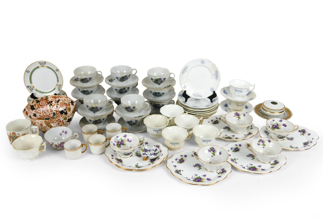 PORCELAIN GROUPING: Mainly teacups and saucers. Variously marked, majority is English or American made, circa 1940s-50s. Dimensions: (Largest) H 4.25" x W 8" x D 7.25" Condition: Minor scuffs and chips. Wear consistent w