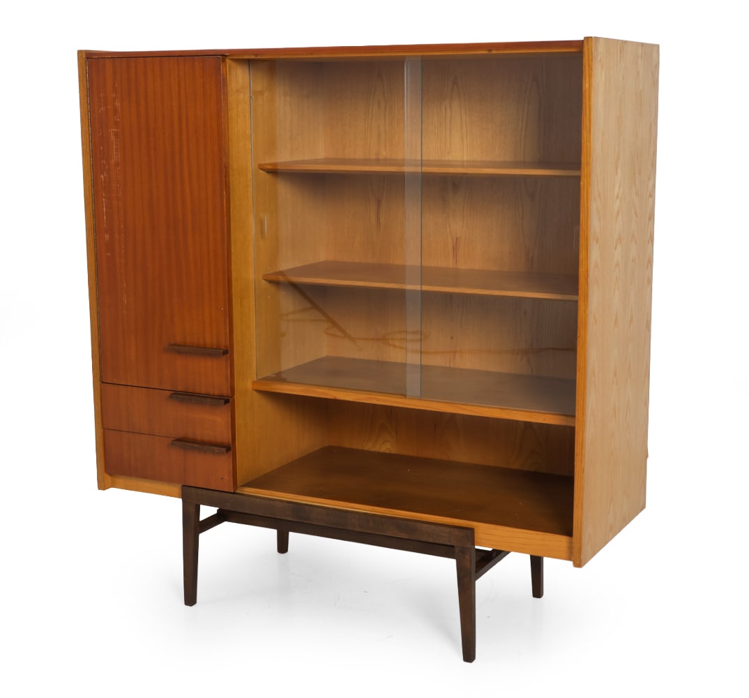 FRANTISEK MEZULANIK FOR UP ZAVODY BOOKCASE 1960S: Model "Elegant". Marked on backside. Ash and mahogany veneer frame. Czechoslovakia, circa 1960s. Dimensions: H 51.75" x W 49" x D 17.75" Condition: Scuffs, discoloration, wear of finish, soiling,