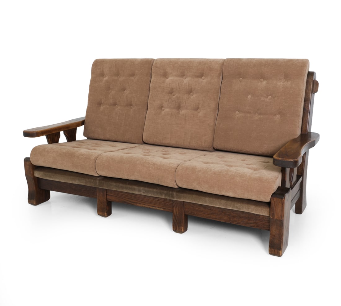DUTCH BRUTALIST OAK & VELOUR SOFA C. 1970S: Tufted velour upholstery with oak frame. Netherlands, circa 1970s. Dimensions: H 39" x W 70.25" x D 30" x SH 17" Condition: Scuffs, dings, and discoloration. Minor fading. Wear consistent with age and