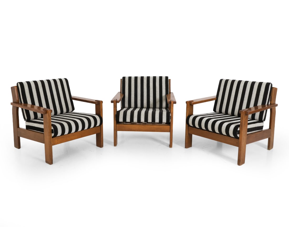 (3) ATTR. SWARZEDZKIE POLISH OAK LOUNGE CHAIRS: Oak frame with stripe upholstery. Apparently unmarked. Poland, circa 1960s. Dimensions: H 28" x W 30" x D 28.5" x SH 15.25" Condition: Scuffs, discoloration, and wear of finish. Wear consistent with a