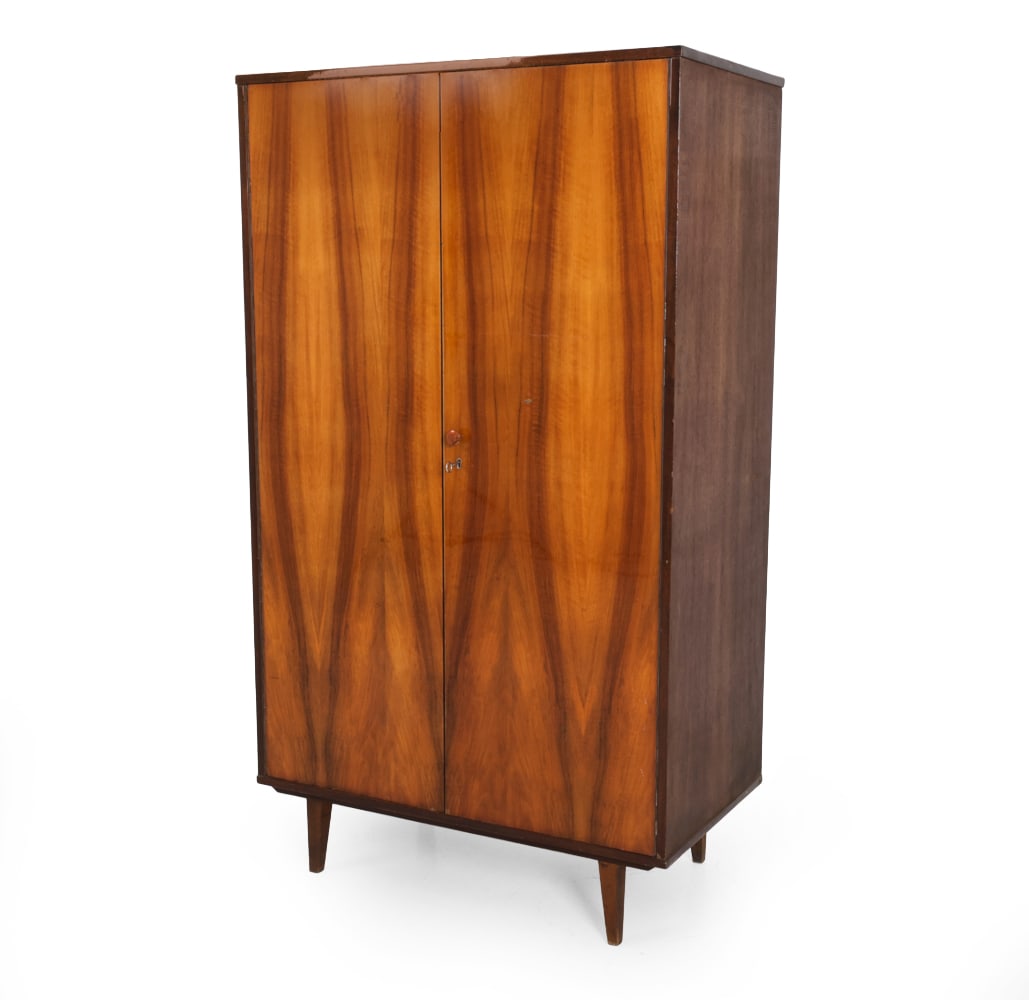 SPOLDZIELNIA POLISH WALNUT CABINET C. 1960S: Walnut and mahogany veneer frame with copper tone knob. Marked to backside. Poland, circa 1960s. Dimensions: H 69" x W 39.25" x D 22.25" Condition: Scuffs and dings. Wear consistent with age and use. 