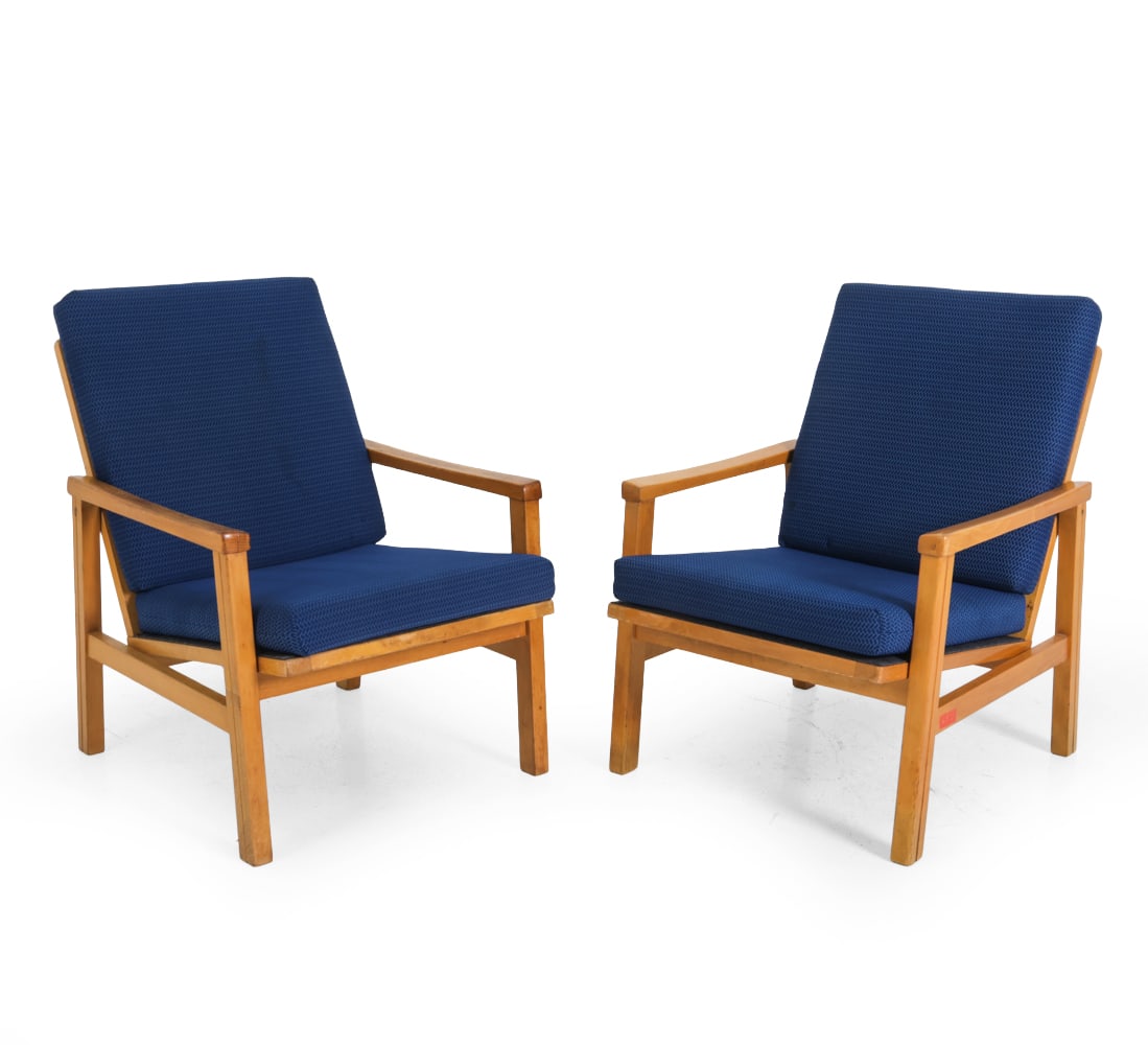 PAIR ATTR. MIROSLAV NAVRATIL CZECH ARMCHAIRS 1970S: Beech frames with blue pattern upholstery. Remnants of labels on undersides. Dimensions: H 27.5 " x W 22" x D 24", SH 15" Condition: Few slats loose. Some scuffs and scratches. Rubs to armrest. Minor 