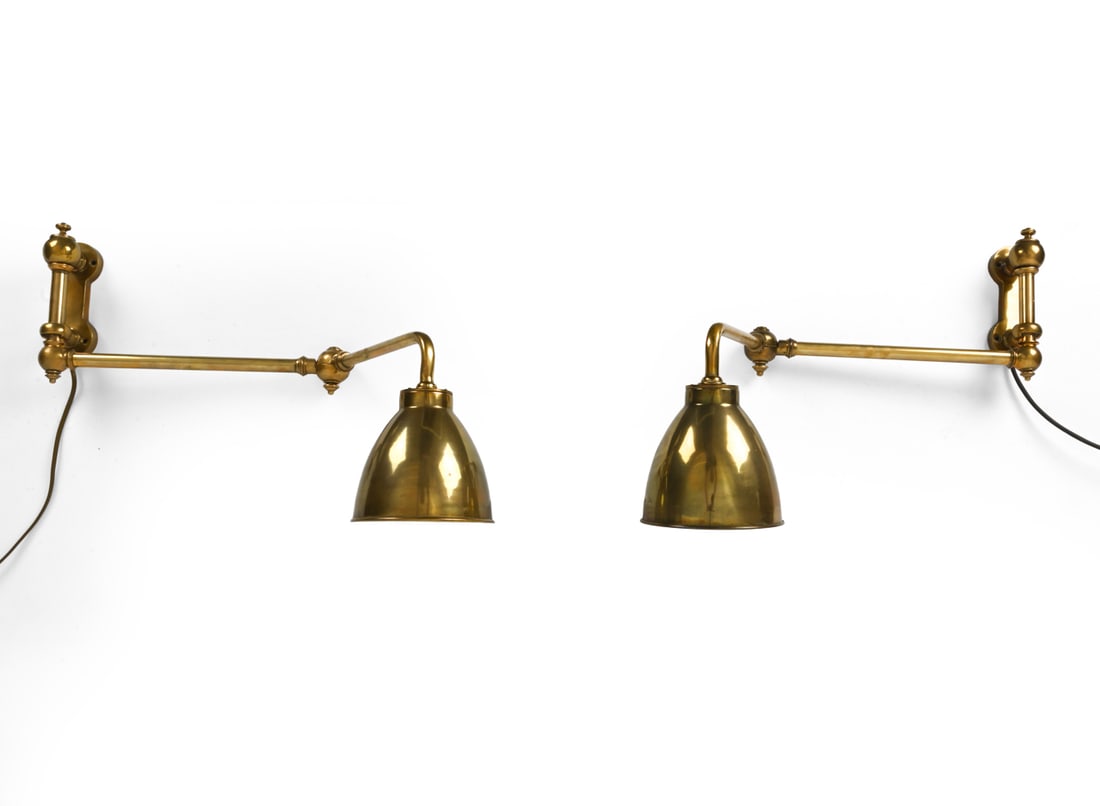PAIR OF BRASS ADJUSTABLE WALL SCONCES: Brass wall lamps with adjustable arms. 20th century. Dimensions: H 8" x W 6.25" x D 28" Condition: Patina of brass, scuffs, and chipping of paint inside shade. Untested. Wear consistent with age and u