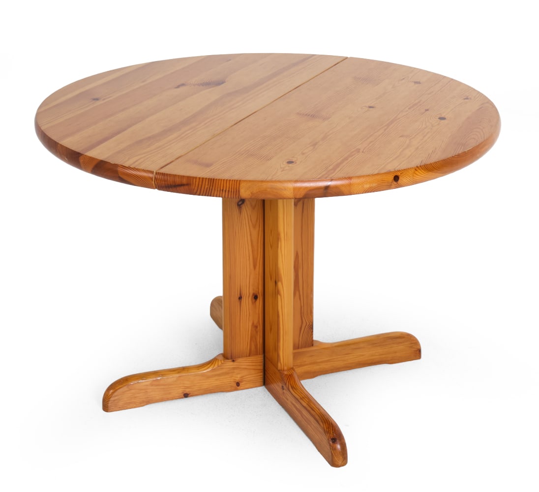 DAUMILLER STYLE DANISH PINE DINING TABLE C. 1970S: Round top dining table. In pine. Denmark, circa 1970s. Dimensions: H 29.75" x Dia 41.5" Condition: Wear consistent with age and use. Nicks, scuffs, rubs. PU44
