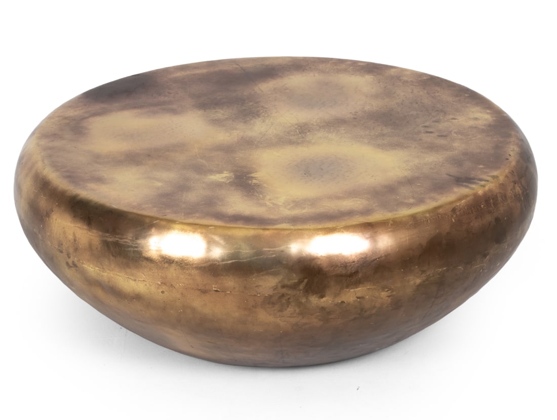ROUND HAMMERED BRASS COFFEE TABLE: Contemporary coffee table made from brass Dimensions: H 15" x Dia 37" Condition: Scuffs and surface marks consistent with age and use.