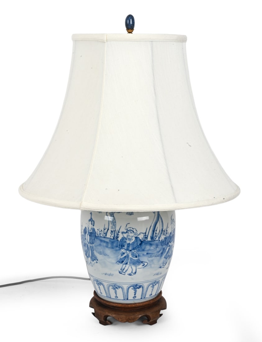 CHINESE BLUE AND WHITE PORCELAIN GINGER JAR LAMP: Dimensions: H 25" x Dia 18" Condition: Wear consistent with age and use. Untested. Scuffs, minor soiling spots and a small tear to the inside part of the shade. Patina to brass. Nicks, fading,
