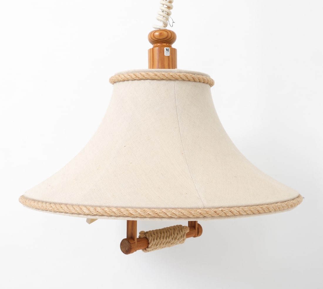 MARKSLOJD SWEDISH PINE PENDANT LIGHT C. 1970S: Pine pendant lamp with a glass globe shade inside center and rope detailing to outer edge. Labeled at top. Pulley system for height adjustment. Sweden, circa 1970s. Dimensions: H 17" x Dia. 21". Condi