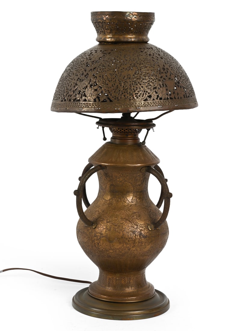 ANTIQUE MOORISH COPPER TABLE LAMP: Etched copper base with perforated filigree shade. Middle Eastern, early 20th century. Dimensions: H 23" x W 10" Condition: Dents, dings, and patina to metal. Untested. Wear consistent with age and us
