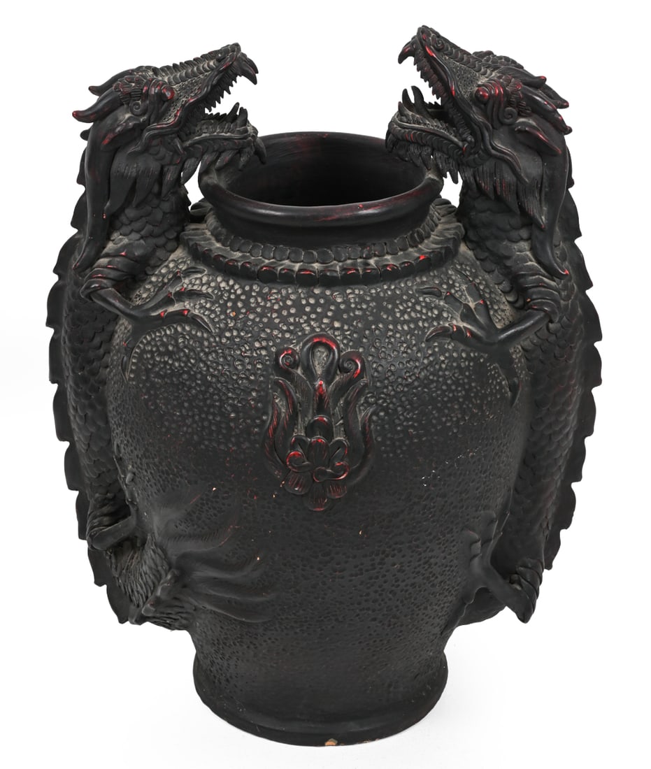 CHINESE DOUBLE DRAGON URN: Heavy dragon-form jardiniere with a dark patinated finish and red underlying layer. Dimensions: H 29" x (widest) W 21" Condition: Loss and localized scuffs to surface. Small chips on the central