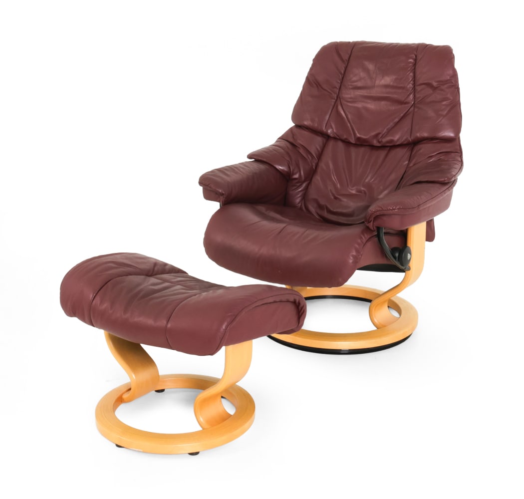 EKORNES "RENO" RECLINING LOUNGE CHAIR & OTTOMAN: Marked to base of chair. Beech frame with leather cushions. Norway, 20th century. Dimensions: (Chair) H 38" x W 28.5" x D 21" x SH 18" (Ottoman) H 13" x W 22" x D 17" Condition: Scuffs and patina of