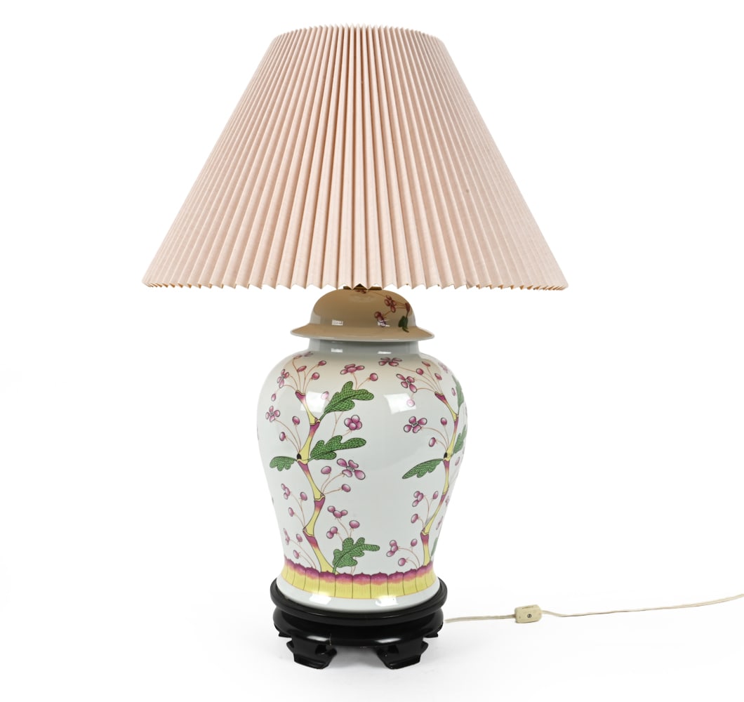 NORMAN PERRY CHINOISERIE PORCELAIN TABLE LAMP: Porcelain with botanical Chinoiserie painted design and carved wood base. C. 1960s Dimensions: H 29.5" x W 19" Condition: Wear of finish and small wood splits at base. Untested. Wear consistent with a
