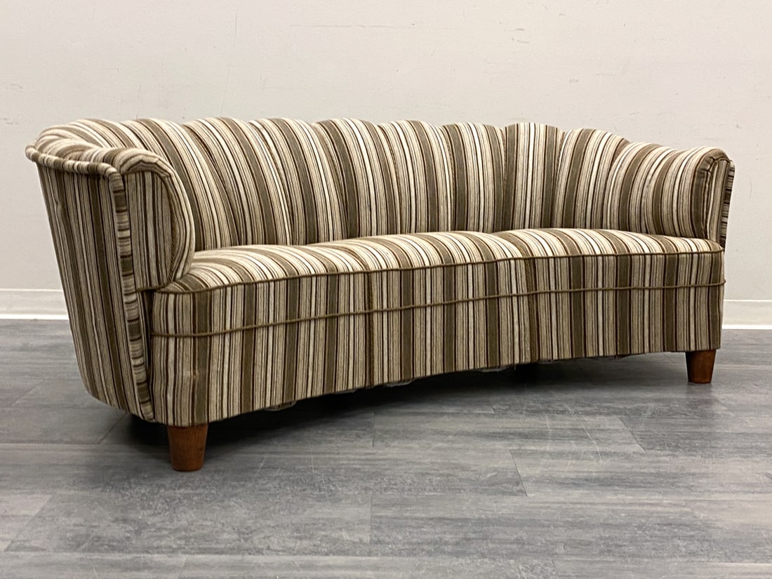 ANDERSSON STYLE SWEDISH BANANA SOFA C. 1940S: Channeled backrest, striped upholstery and oak legs. Sweden, circa 1940s. Dimensions: H 29.5" x W 78" x D 40" Condition: Wear consistent with age and use. Scuffs, nicks to legs. Small distress mark to