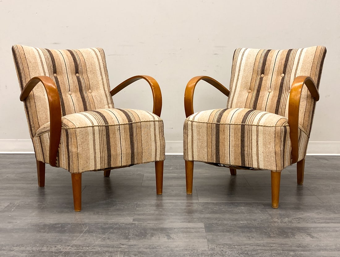 PAIR OF HALABALA STYLE LOUNGE CHIARS C. 1940S: Beech frame with striped upholstery. Czechoslovakia, circa 1940s. Dimensions: H 31" x W 24.75" x D 25" x SH 16" Condition: Wear consistent with age and use. Nicks, rubs, fading, discoloration to armre