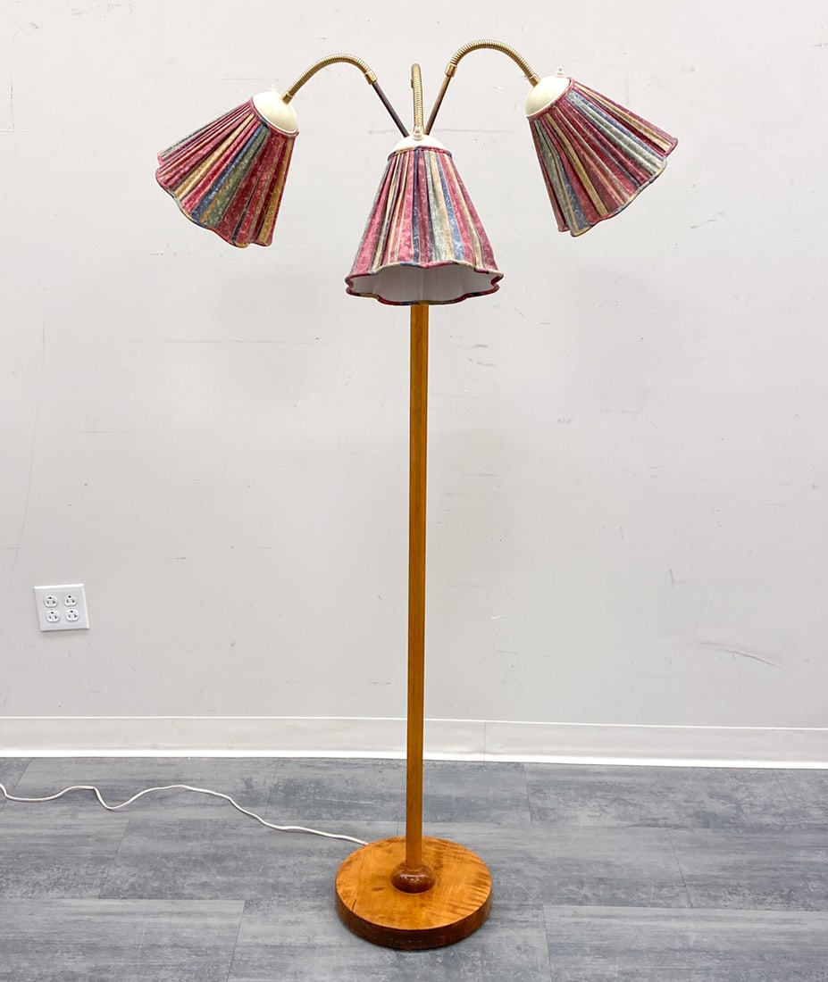 SCANDINAVIAN TRIPLE ARM FLOOR LAMP: Brass and birch frame with colorful shades. Scandinavian, circa 1950s. Dimensions: H 78" x Dia 17" Condition: Wear consistent with age and use. Untested, European plug. Scuffs, nicks, minor rubs to ba