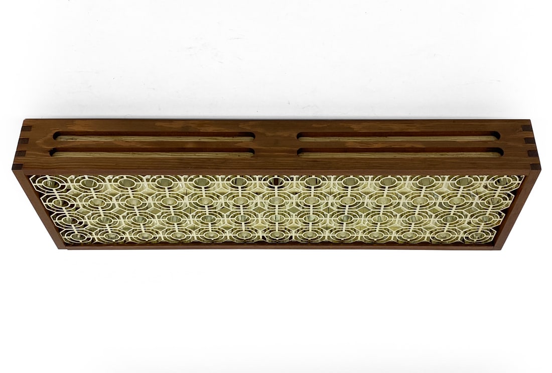 SCANDINAVIAN PINE CEILING LIGHT C. 1960S: Pine frame and gold-tone grill. Scandinavian, circa 1960s. Dimensions: H 4" x W 27" x D 9" Condition: Sun fading. Loose joinery. Losses to mesh/shade surrounding. Wear consistent with age and use.