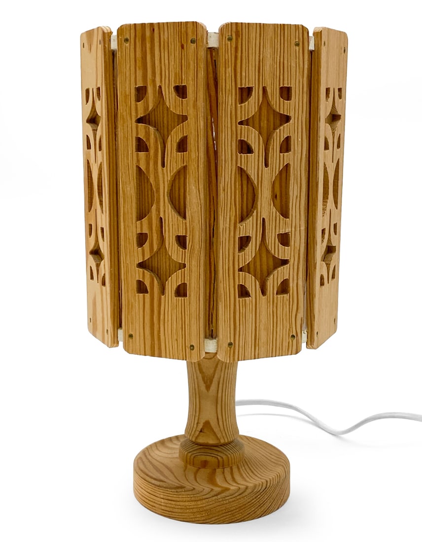 SWEDISH PINE TABLE LAMP C. 1970S: Sweden, circa 1970s. Dimensions: H 11.5" x Diameter 6" Condition: Wear consistent with age and use. Untested European plug. Scuffs.