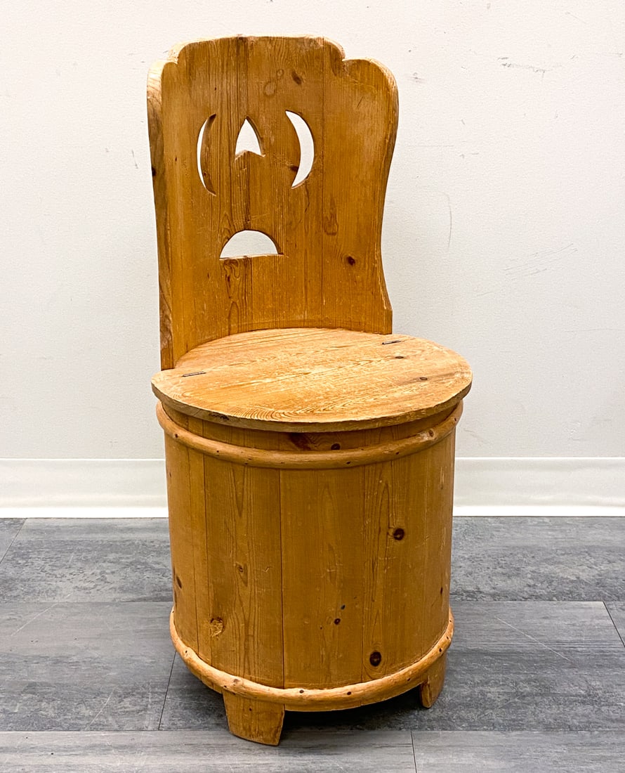 SCANDINAVIAN PINE LOG CHAIR C. 1920S: Kubbstol (in Sweden) or Kubbestol (in Norway). Features lift up seat for storage. Scandinavian, circa 1920s. Dimensions: H 30" x Dia 15.5" Condition: Wear consistent with age and use. Scuffs, rubs, wa