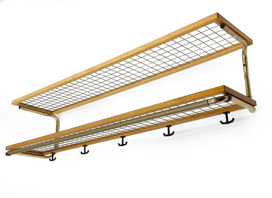 SWEDISH BEECH AND BRASS HAT RACK C. 1960S: Dimensions: H 11.25" x W 47" x D 11.5" Condition: Wear consistent with age and use. Scuffs, rubs, fading, minor soiling. Hardware included.