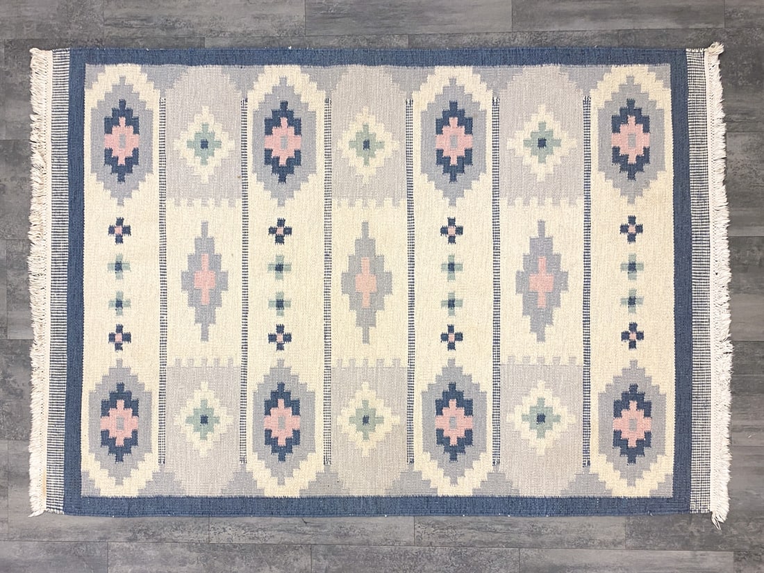 ROLLAKAN SWEDISH FLATWEAVE RUG C. 1960S: Dimensions: L 81.5" x W 55.75" Condition: Minor soiling spots, losses to border and fringe. Wear consistent with age and use.