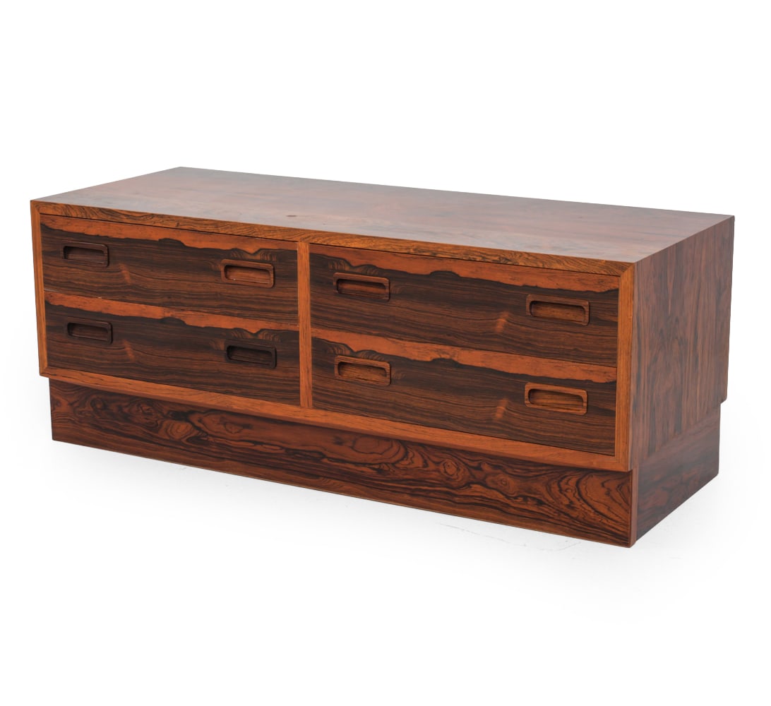 POUL HUNDEVAD DANISH ROSEWOOD LOW CHEST OF DRAWERS: Rosewood frame. Danish manufacturing label marked inside and Hundevad marked to backside. Denmark, circa 1960s. Dimensions: H 16.75" x W 42.5" x D 17" Condition: Dings, scratches, sun fading, wear con