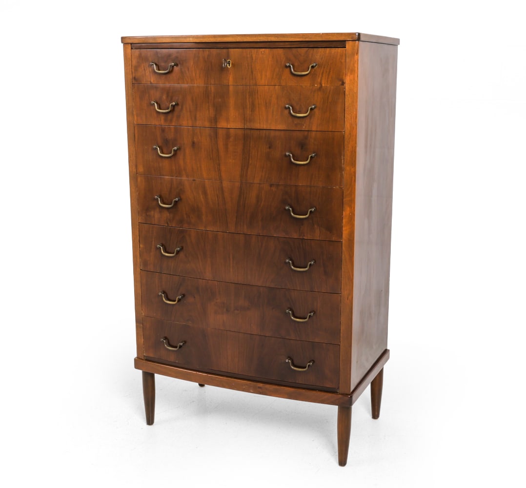 WANSCHER STYLE WALNUT CHEST OF DRAWERS C. 1950S: Walnut frame with brass hardware. Key included. Denmark, circa 1950s. Dimensions: H 48." x W 28.25" x D 16.5" Condition: Scuffs, dings, and loss to finish. Wear consistent with age and use. F151