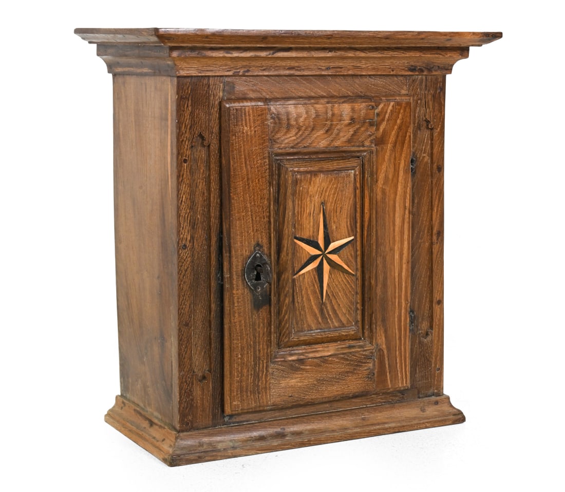 19TH C. ANTIQUE SCANDINAVIAN OAK CABINET: Key included. Carved oak with inlaid nautical star design. Scandinavian, 19th century. Dimensions: H 25 " x W 23.5 " x D 13 " Condition: Scuffs, splits in wood, and wear of finish. Chips on back near 
