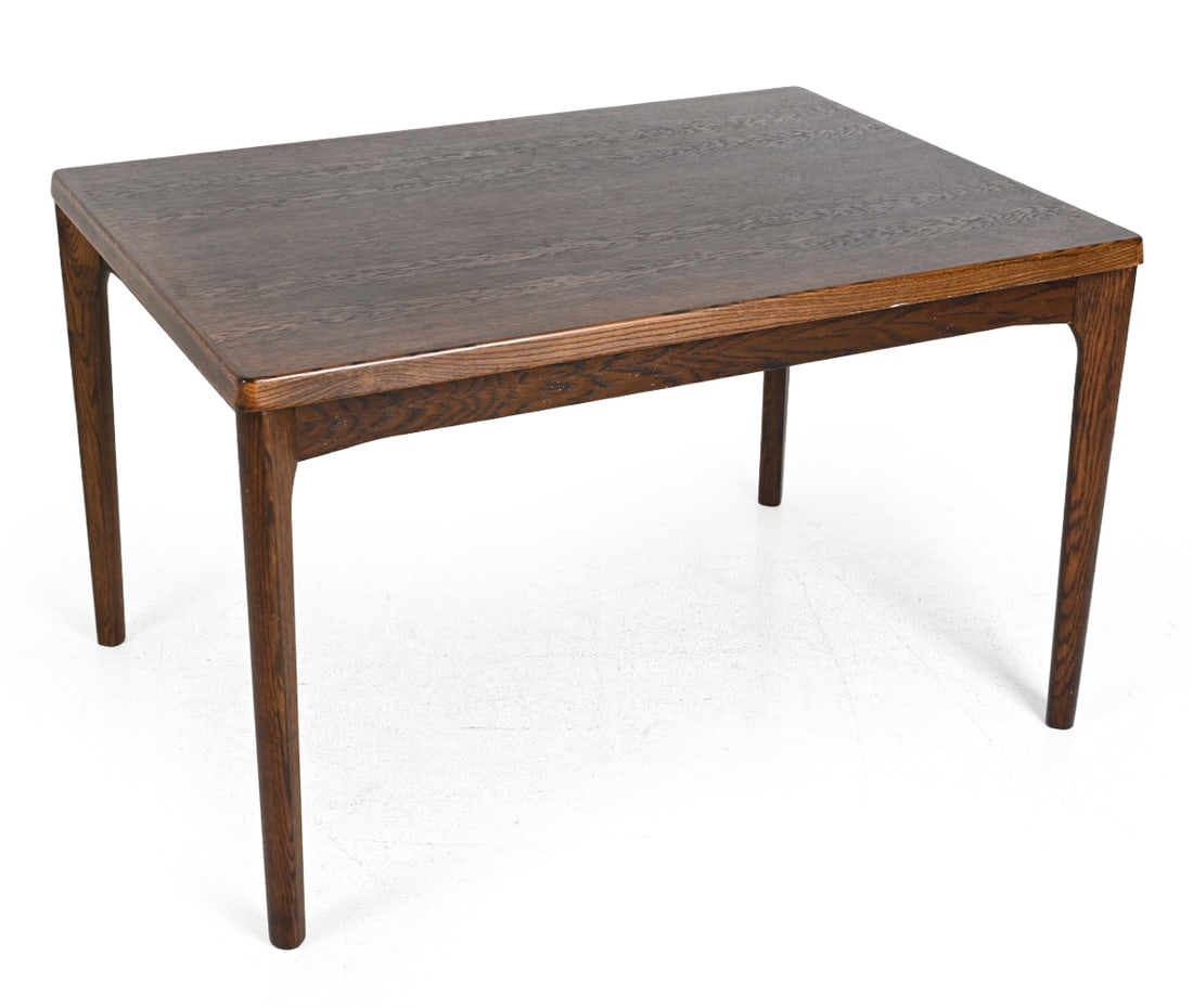 HENNING KJAERNULF FOR VEJLE OAK DINING TABLE 1960S: Marked underneath. Denmark, circa 1960s. Dimensions: H 29" x W 82.5" x D 32.5" Condition: Some minor scratches. Sun fading to finish. Losses to edges and corner of top. Wear consistent with age and