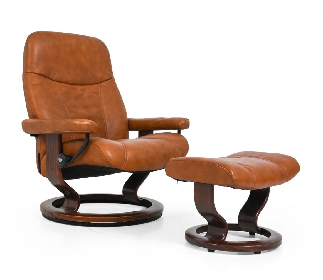 EKORNES STRESSLESS LEATHER LOUNGE CHAIR & OTTOMAN: Model "Consul". Beech frame with leather upholstery and swivel base. Marked to hardware. Norway, 20th century. Dimensions: H 40" x W 33.5" x D 34.5" x SH: 17.75" Condition: Scuffs to arm rests. Scuff/