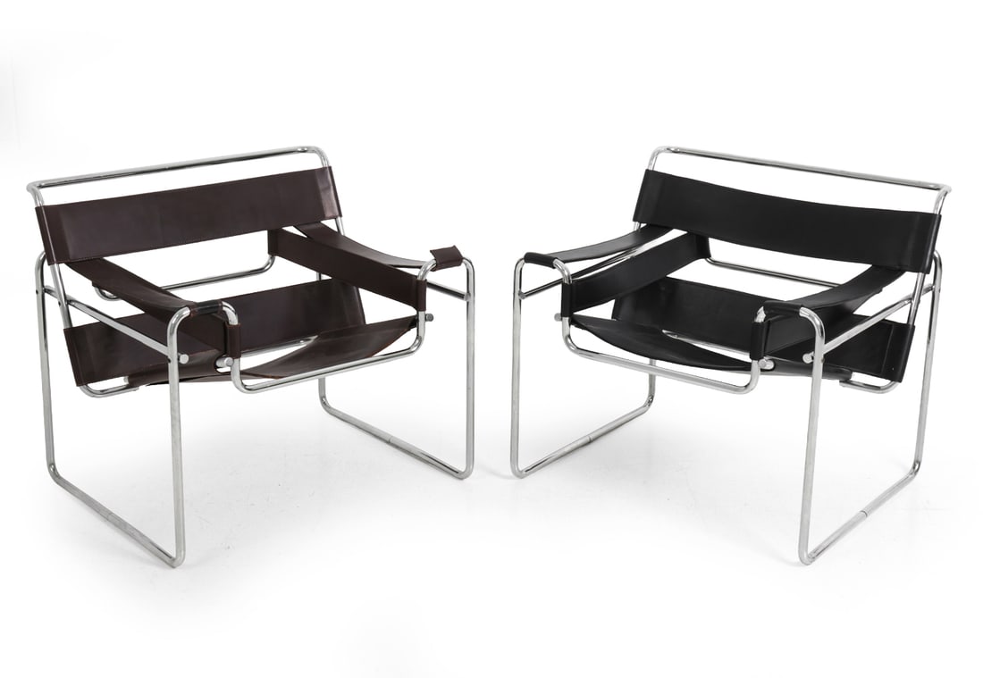 (2) MARCEL BREUER FOR KNOLL WASSILY CHAIRS 1970S: Produced by Knoll International, marked and dated underneath one chair. Chrome tubular steel frame. One with black leather straps upholstery and another with brown leather straps upholstery. Circa 197