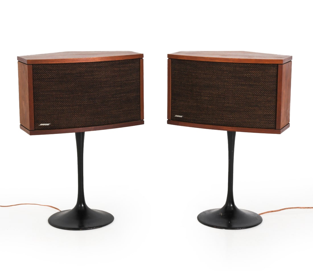 PAIR OF BOSE 901 SERIES IV SPEAKERS 1978: Direct/Reflecting walnut speakers with tulip stands with owners manual. Marked to underside and front. Circa 1978. Dimensions: H 31" x W 21" x D 13" Condition: Wear consistent with age and use.