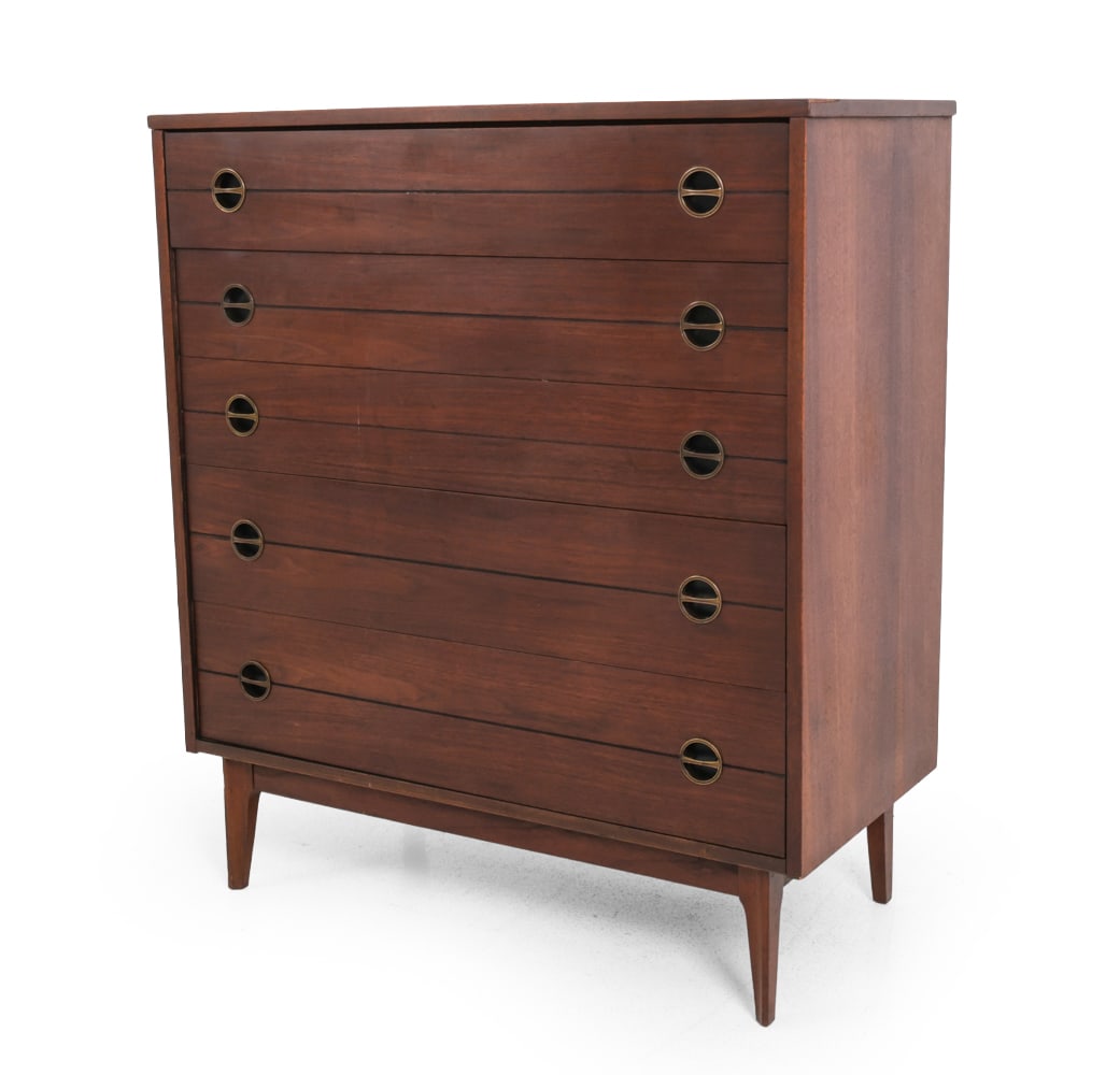 WALNUT CHEST OF DRAWERS C. 1960S: Walnut with recessed brass drawer pulls and tapered legs. Circa 1960s. Dimensions: H 43.25" X W 38" X D 18". Condition: Discoloration and watermarks, especially on top surface. Losses to veneer,