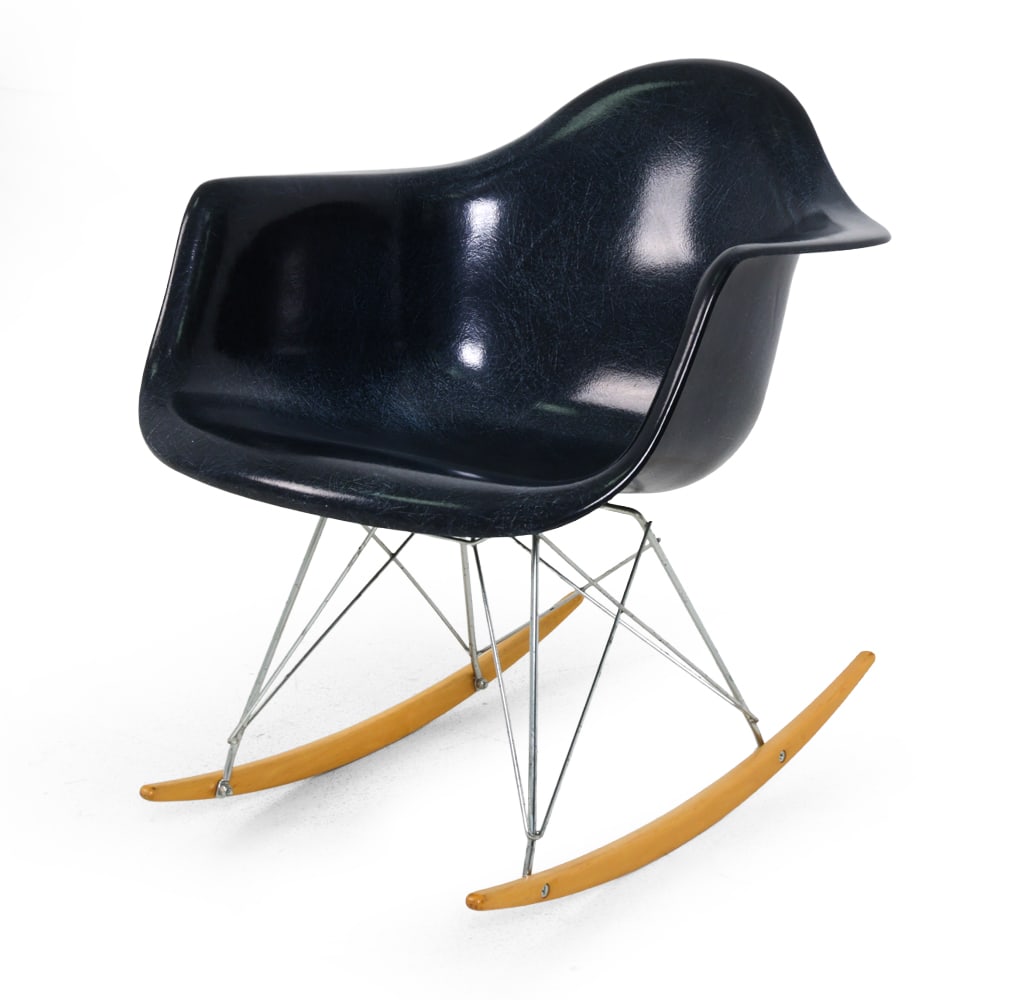 MODERNICA CASE STUDY ARM SHELL ROCKING CHAIR: Marked underneath. Molded fiberglass arm shell seat with chrome wire base and wood rockers. 20th century. Dimensions: SH 15 " x H 27 " x W 24.5 " x D 20 " Condition: Heavy scratches. Minor