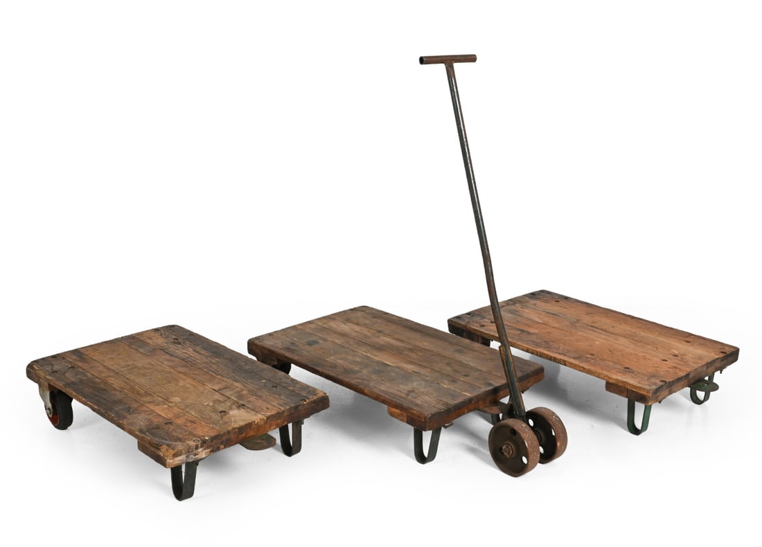 ANTIQUE INDUSTRIAL WOODEN FACTORY CARTS: (3) total. Along with one moving and steering handle. Dimensions: (Tallest) H 53'' x W 24'' x D 36'' Condition: nicks and cracks to wood, watermarks and staining. Wear consistent to age and use.