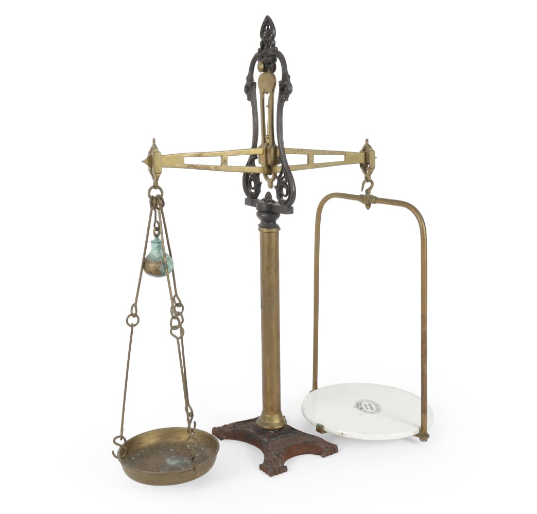 ANTIQUE J NEWMAN IRON & BRASS BALANCE SCALE: Iron and brass scale with porcelain plate for weighing. Plate and top of scale are labeled. Ireland, late 19th century. Dimensions: H 34" x W 27" x D 11" Condition: Oxidation, scuffs, discoloration, w