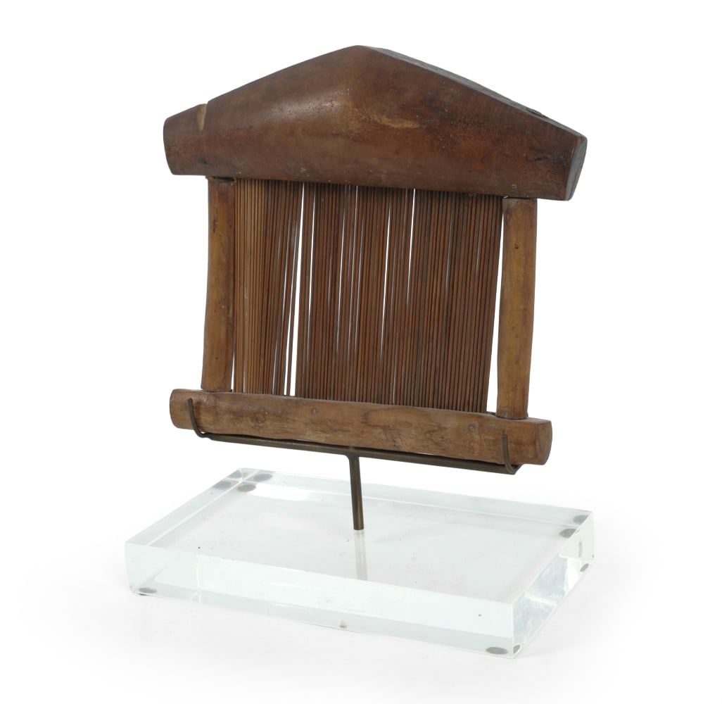 ANTIQUE WEST AFRICAN BAOULE LOOM BEATER: Loom reed for compacting and weaving threads on strip looms. Sitting atop a lucite base with custom stand. Made from carved wood. Dimensions: H 10" x W 7.5" x D 2.5" Condition: Loss to top, stress cra