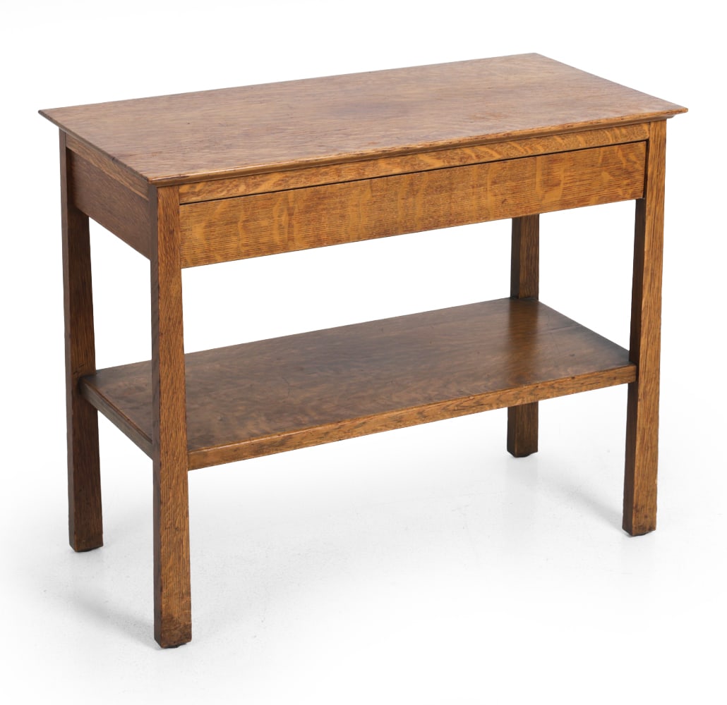 ARTS & CRAFTS OAK SIDE TABLE C. 1930S: Oak with two tiers. Circa 1930s. Dimensions: H 29.5" x W 36" x D 18" Condition: Light scuffs, water staining/sun fading to top. Stress cracks to lower shelf. Wear consistent with age and use.