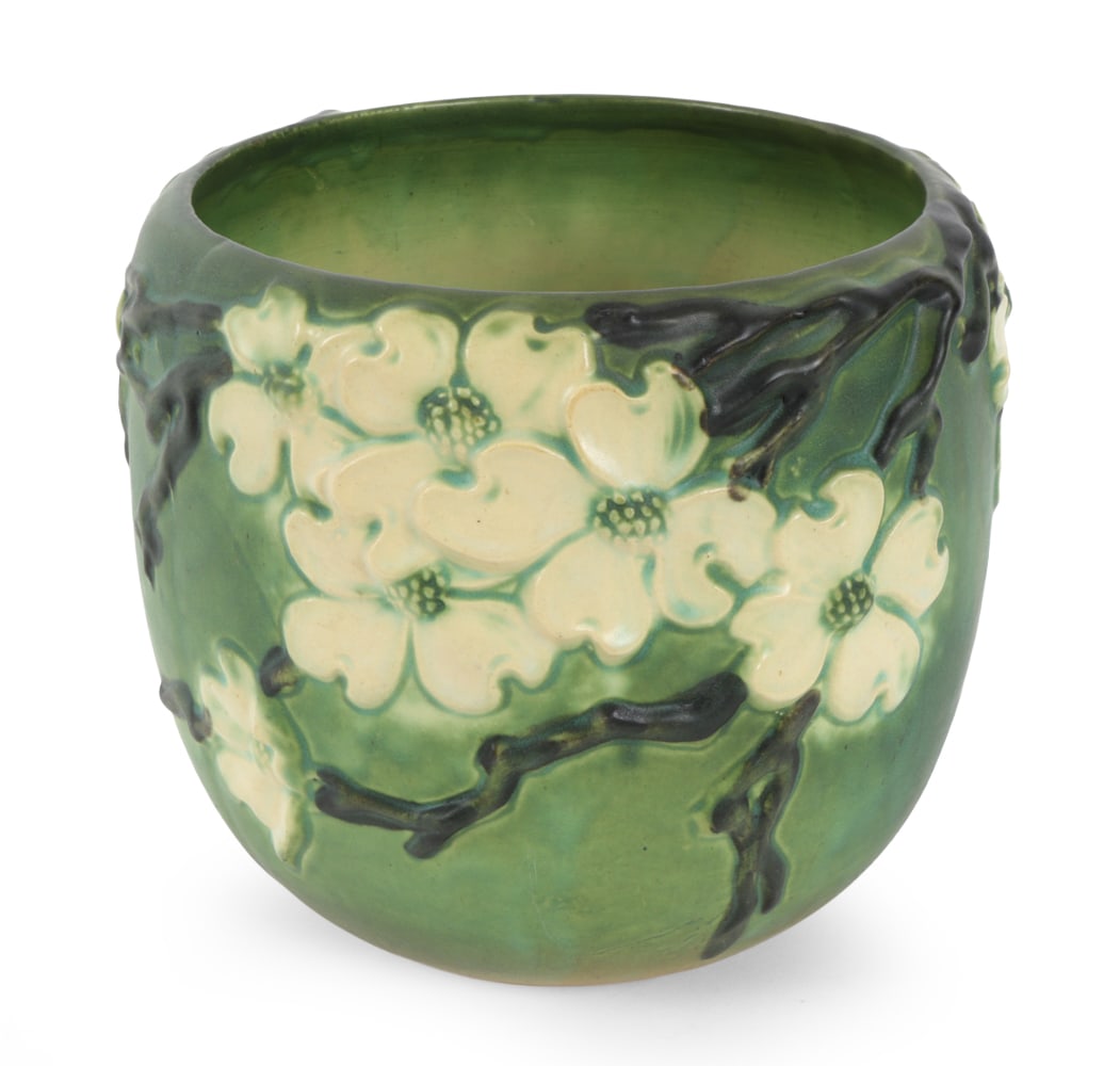 ROSEVILLE DOGWOOD SMOOTH PLANTER C. 1920S: Apparently unmarked. Raised floral Dogwood design. Circa 1920s. Dimensions: H 8.5" x W 9.5" Condition: Scuffs and light wear of finish. Wear consistent with age and use.
