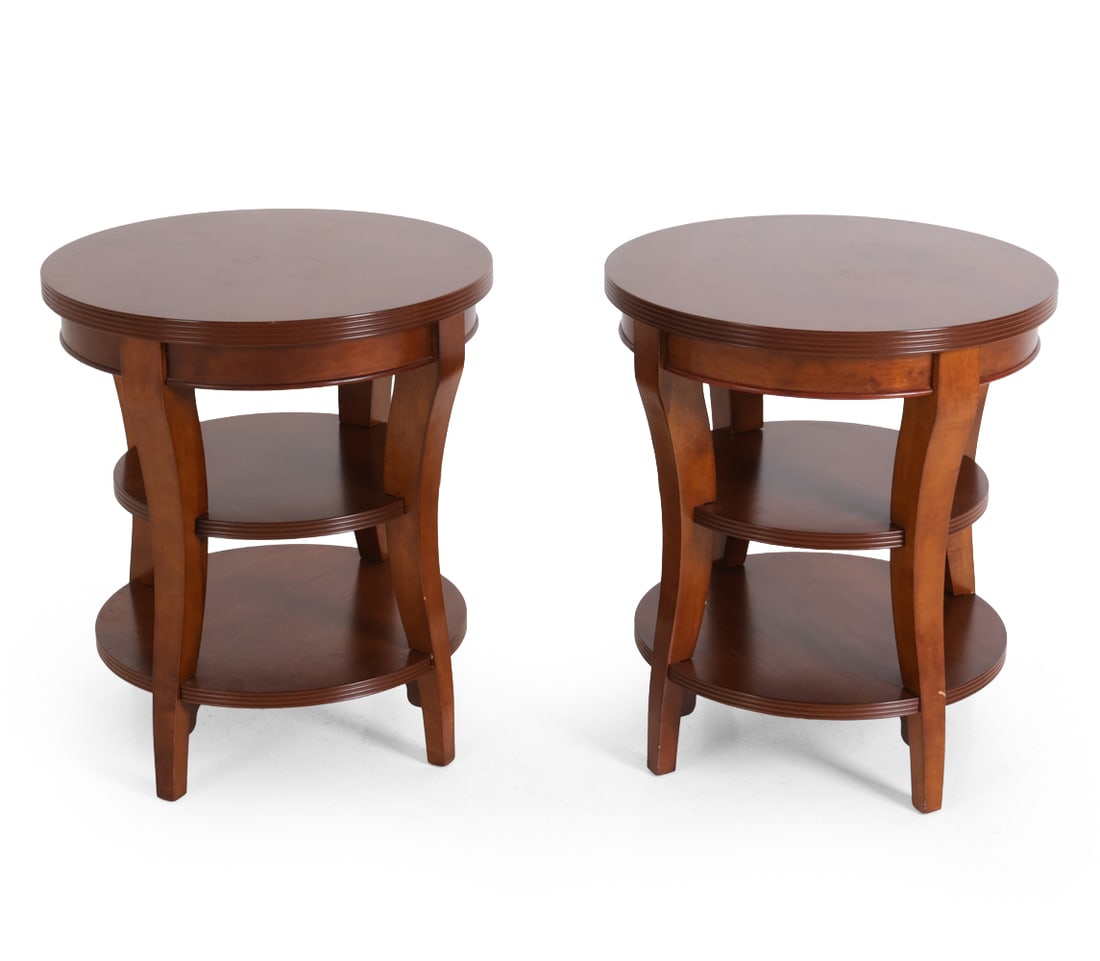 PAIR OF BAKER STYLE CHERRYWOOD SIDE TABLES: Three-tier side table with carved detail to side. 20th century. Dimensions: H 28" x W 24" Condition: Minor scuffs. Wear consistent with age and use.