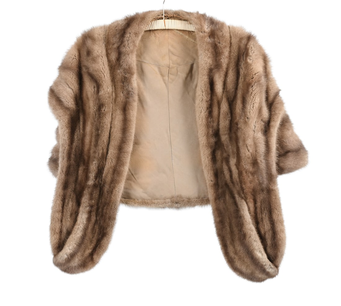 VINTAGE MINK FUR SHAWL C. 1930S: Embroidered "Lee" inside. Real mink fur. Shawl with armholes. Dimensions: Chest Width: 18" x Front length: 28" x Bottom width: 27" x Back width: 24.5" Condition: Tears, stains, and visible repairs in 
