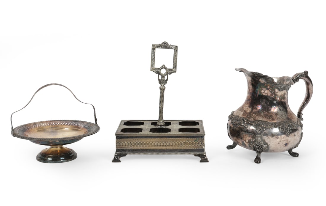 SILVER PLATE GROUPING INCL. BROGERS: (3) total. Including condiment stand, pitcher and a pedestal plate. All marked, Brogers Silver Co and John Wanamaker. Dimensions: (Largest) H 10.75 " x W 7.75 " x D 5.5 " Condition: Wear consistent